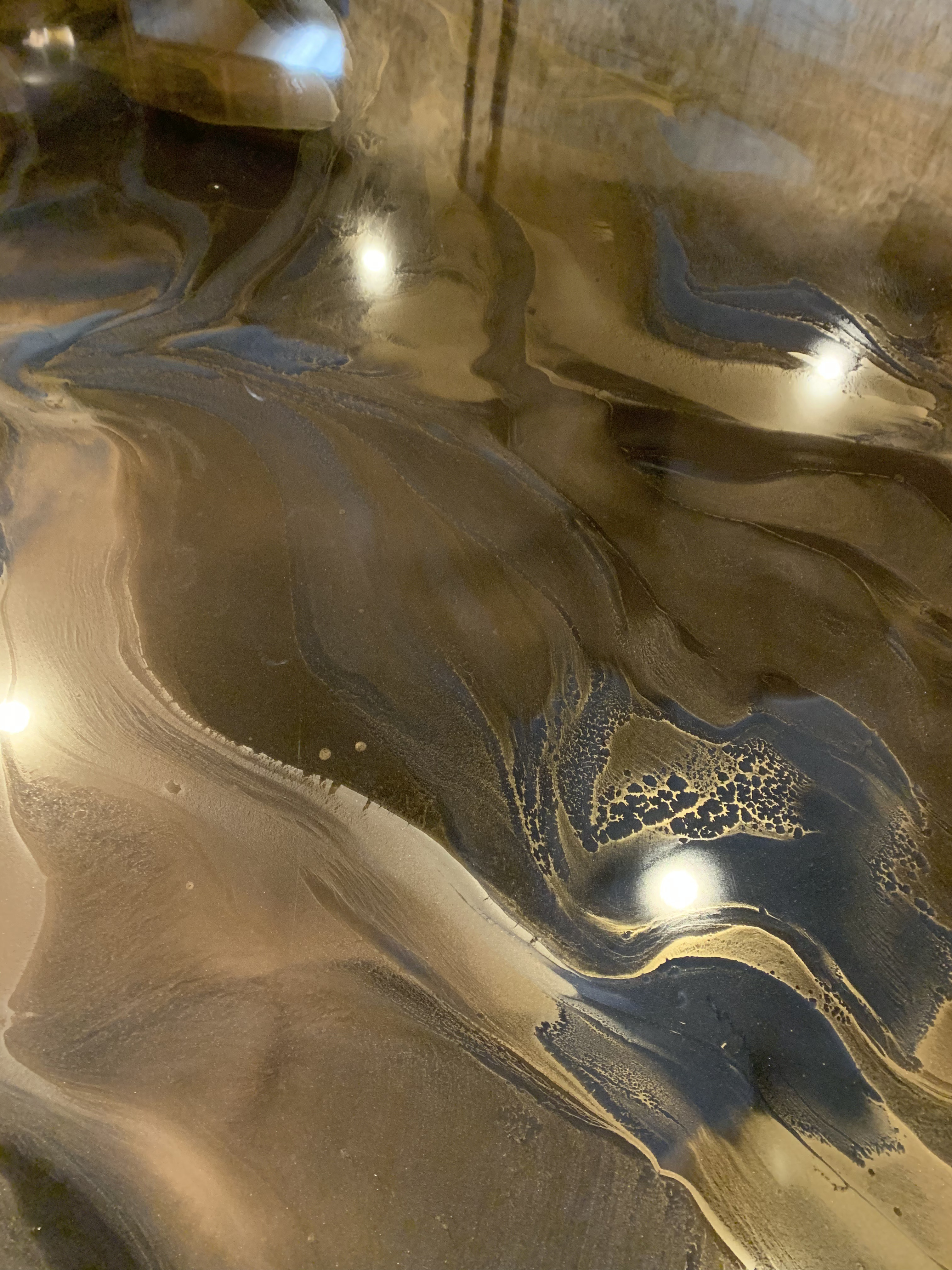 Gold metallic epoxy flooring in a residential setting